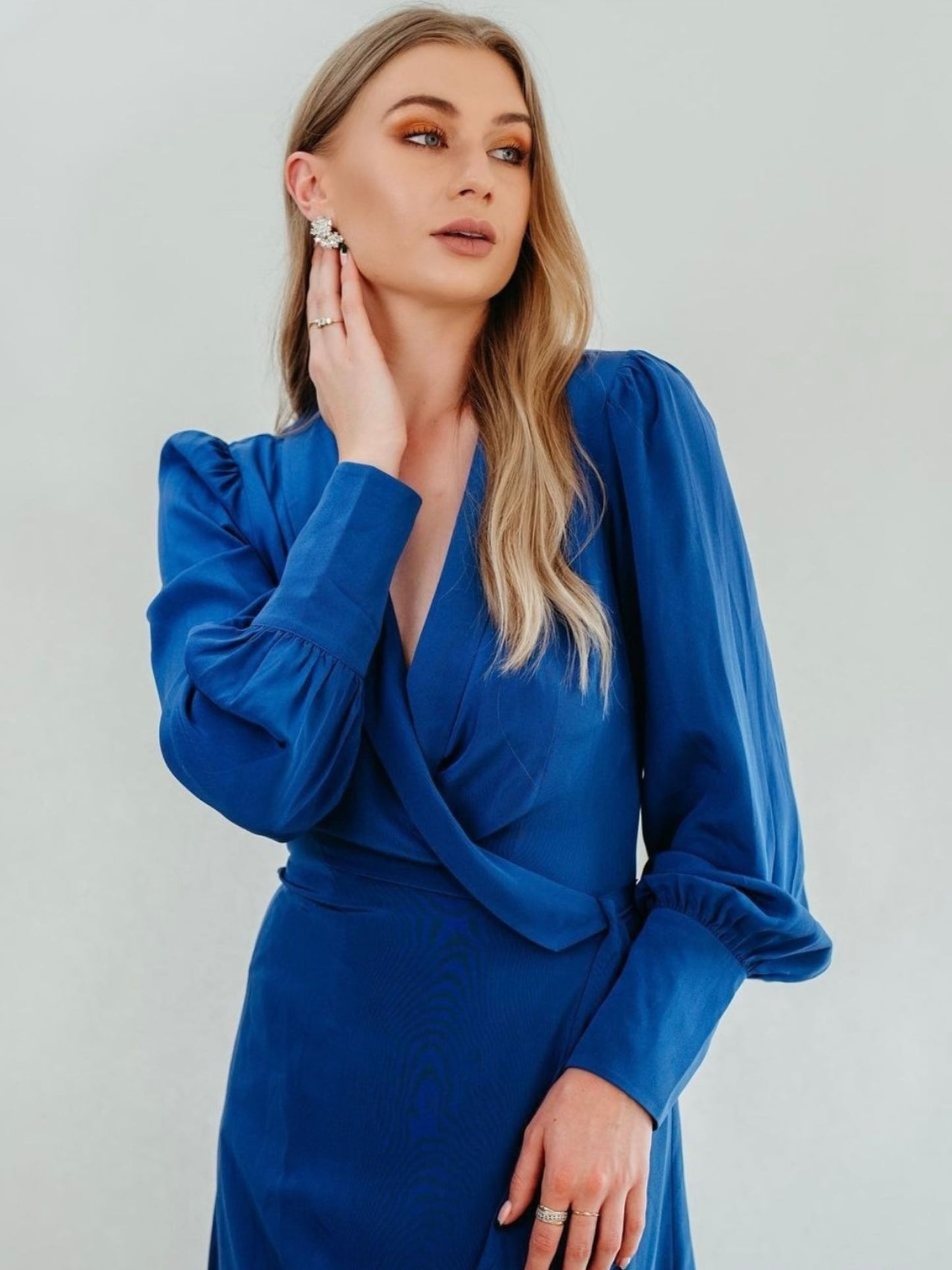 Model Lydia Wearing Mera Silk Mira Wrap Dress in Blue