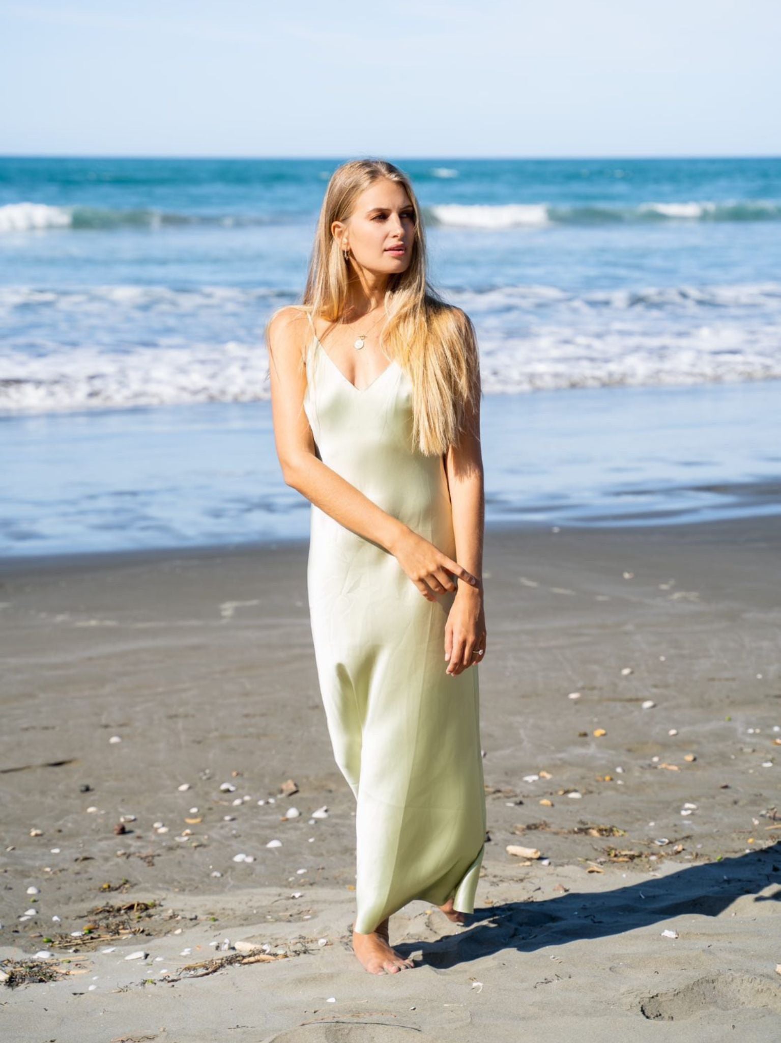 Model Mehgan Kenney wearing Mera Silk Tokyo Slip in Sage