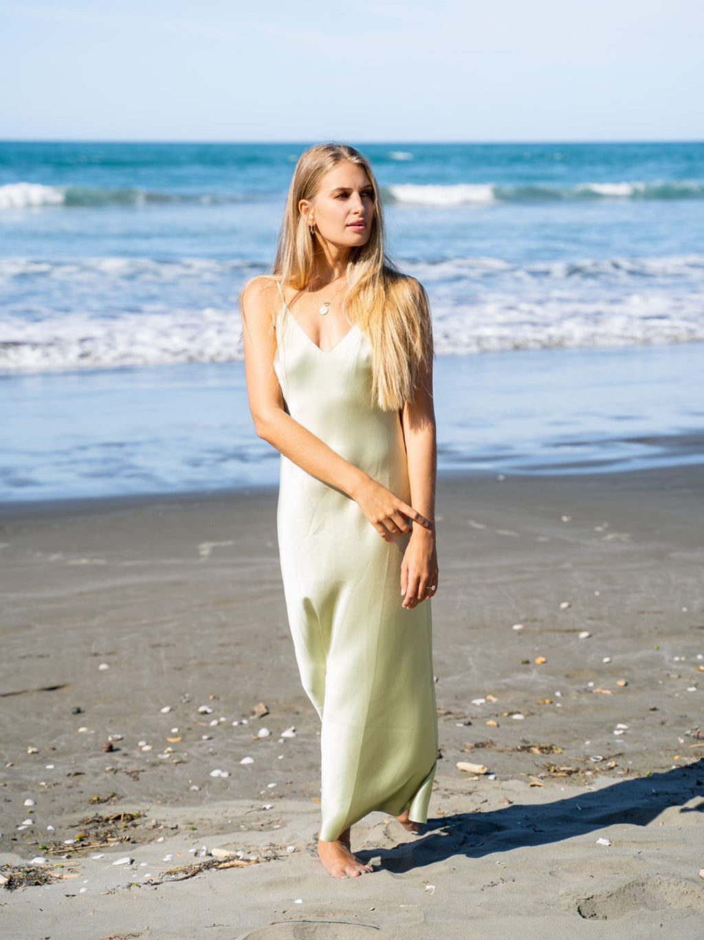 Model Mehgan Kenney wearing Mera Silk Tokyo Slip in Sage
