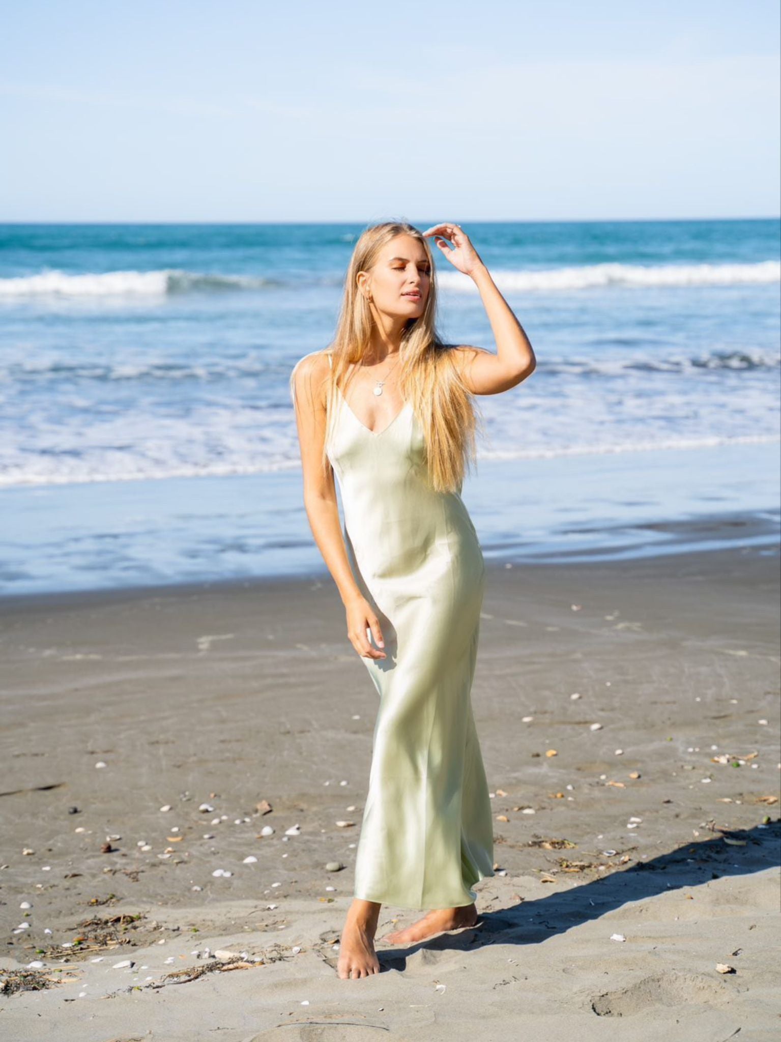 Model Mehgan Kenney wearing Mera Silk Tokyo Slip in Sage