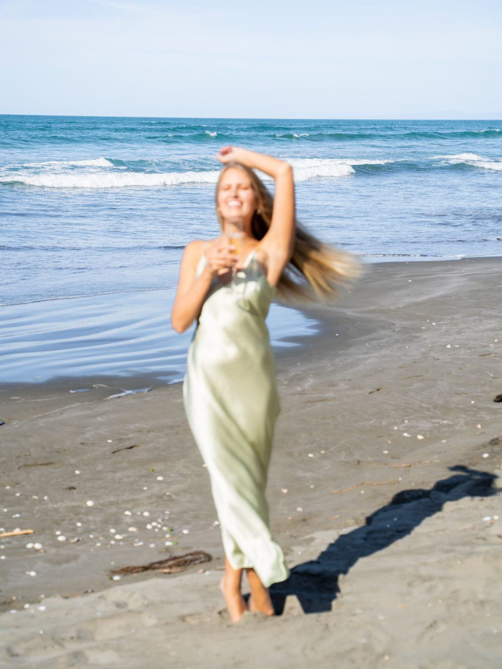 Model Mehgan Kenney wearing Mera Silk Tokyo Slip in Sage