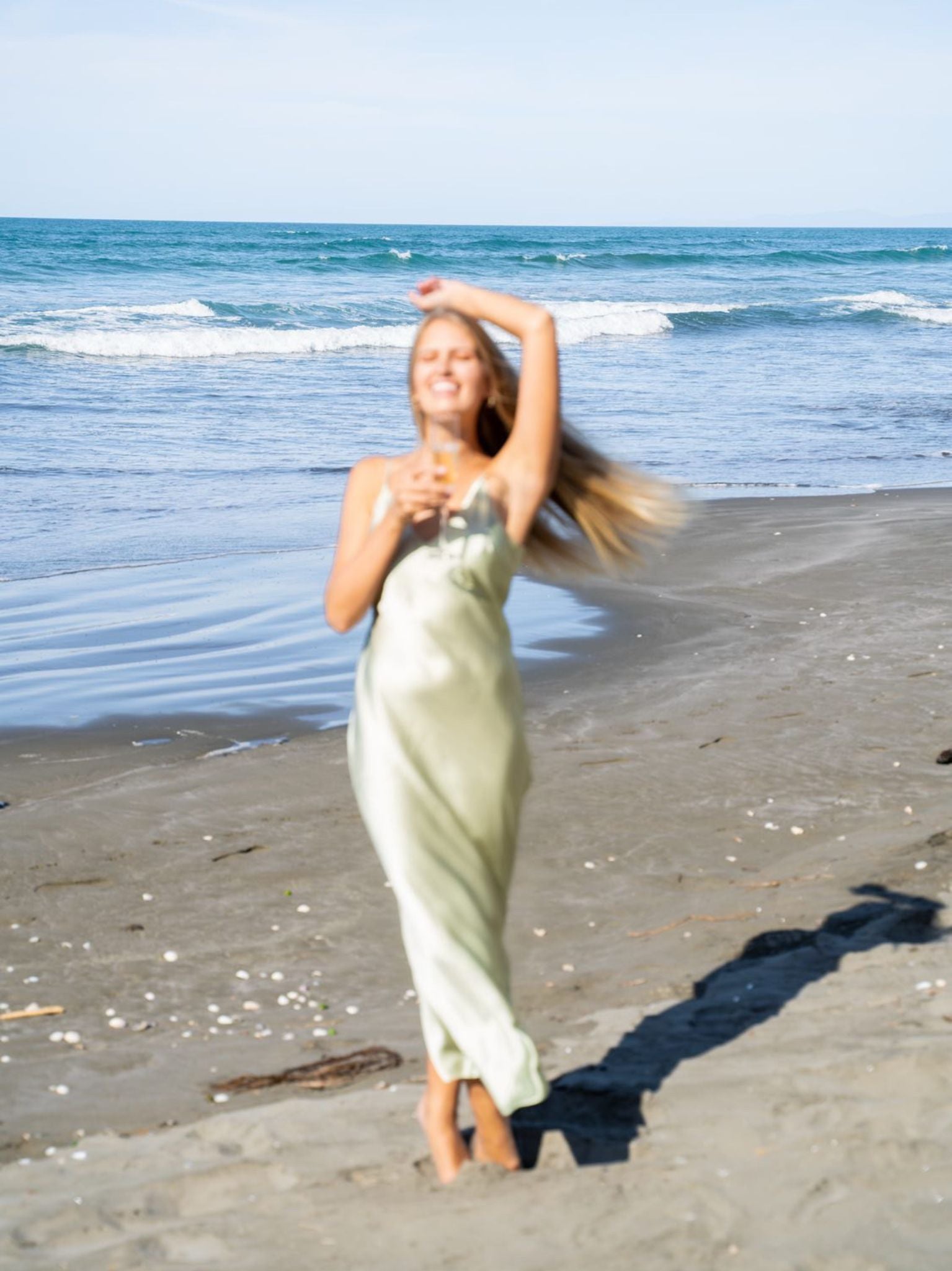 Model Mehgan Kenney wearing Mera Silk Tokyo Slip in Sage